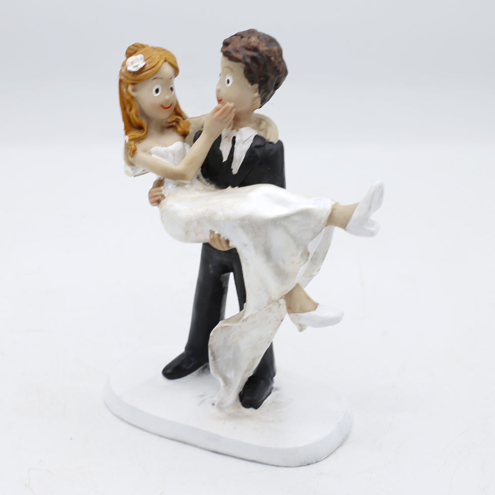 Groom Carries Bride Cake Topper