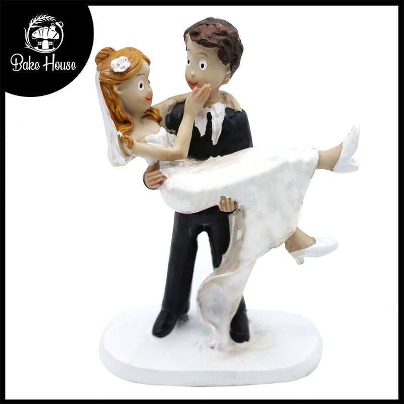 Groom Carries Bride Cake Topper