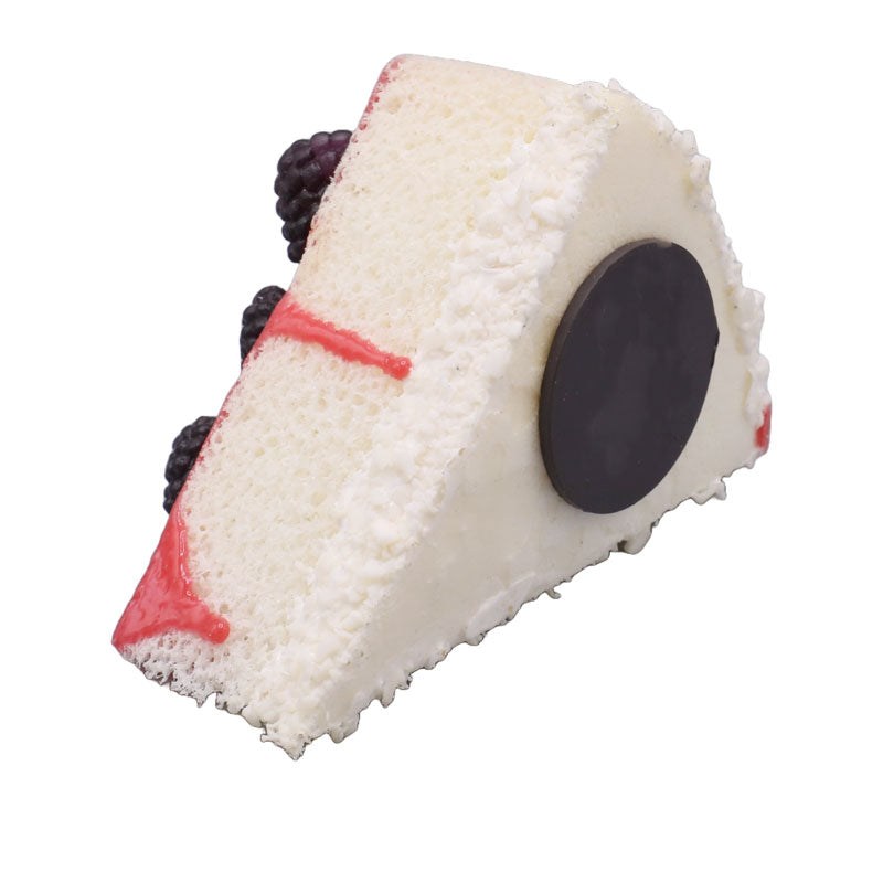 Realistic Artificial Triangle Pastry With Black Rasberry Topping