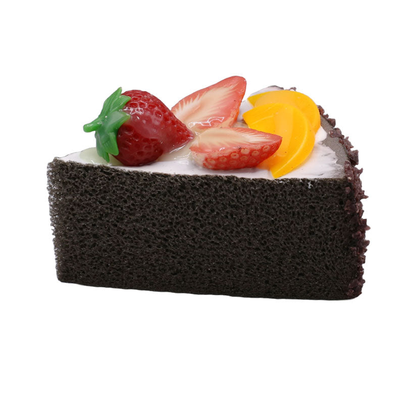 Realistic Artificial Chocolate Triangle Pastry With Mangoes And Strawberry Topping