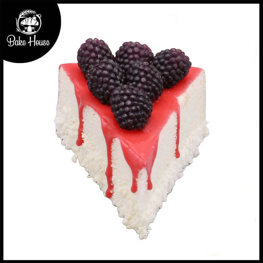 Realistic Artificial Triangle Pastry With Black Rasberry Topping